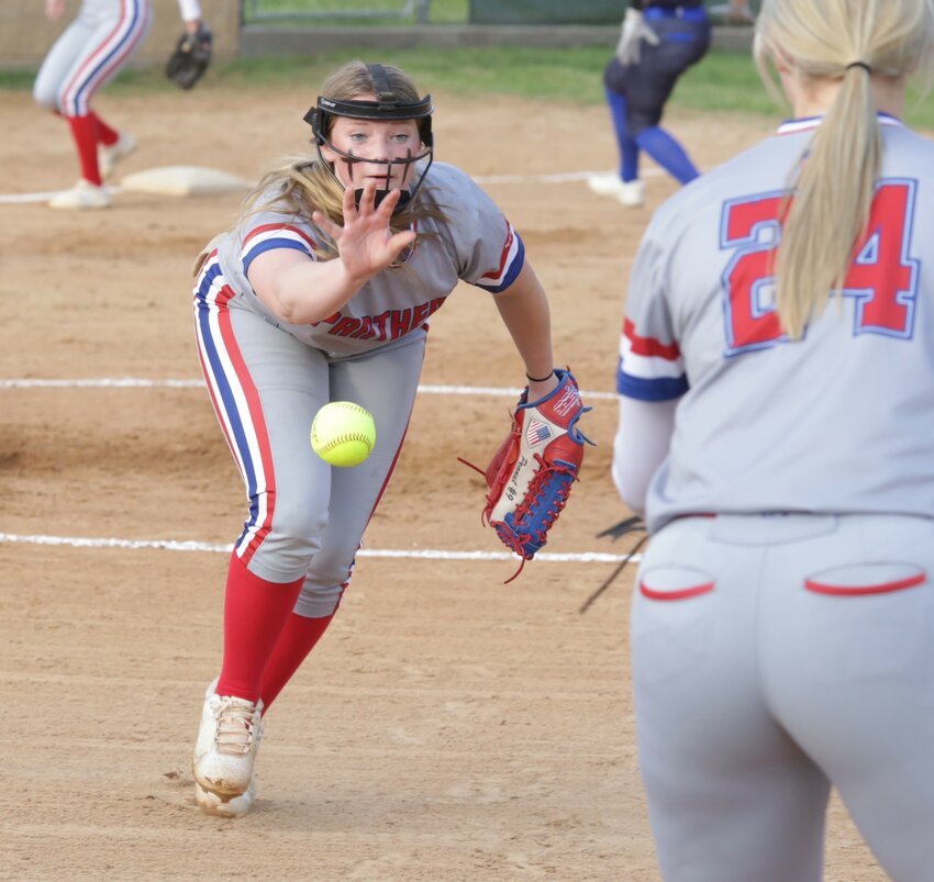 Alba-Golden&rsquo;s Adielyn Smith comes off the mound and tosses to Alexis Wilmut at first after fielding a bunt in the win over Detroit.