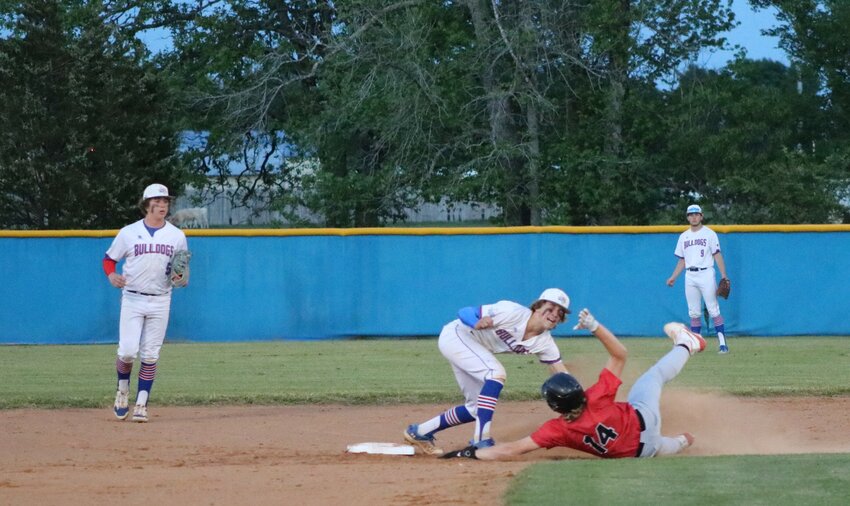Davis Watson tags out a Chapel Hill runner at second base.