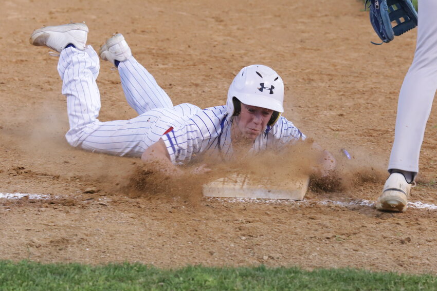Alba-Golden&rsquo;s Brett Sutton takes third base with a head-first slide last Thursday.