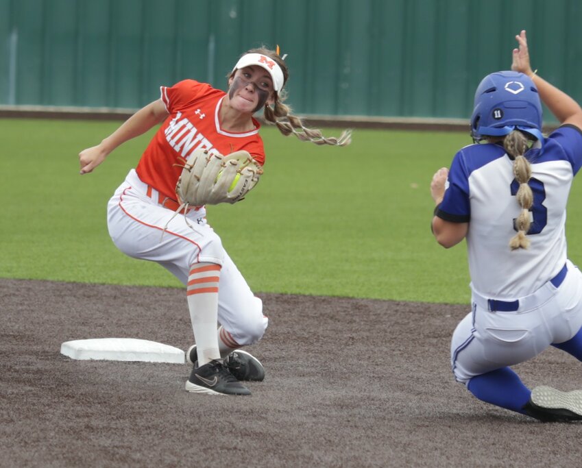 Mineola shortstop Kaitlyn McMahon prepares to apply the tag to a Lady Dragon.