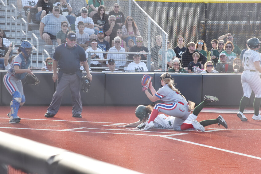 Alba-Golden pitcher Adielyn Smith gets the throw from backup catcher Kayleigh Logan too late to stop the Crossroads runner from third after the pitch got away. The Lady Panthers fell 8-1 Friday and were eliminated from the state playoffs.