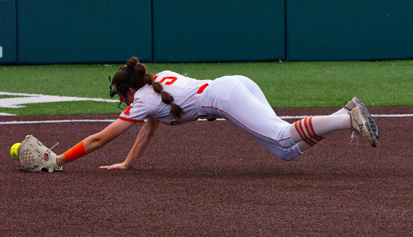 Jadelyn Marshall dives for a pop-up.