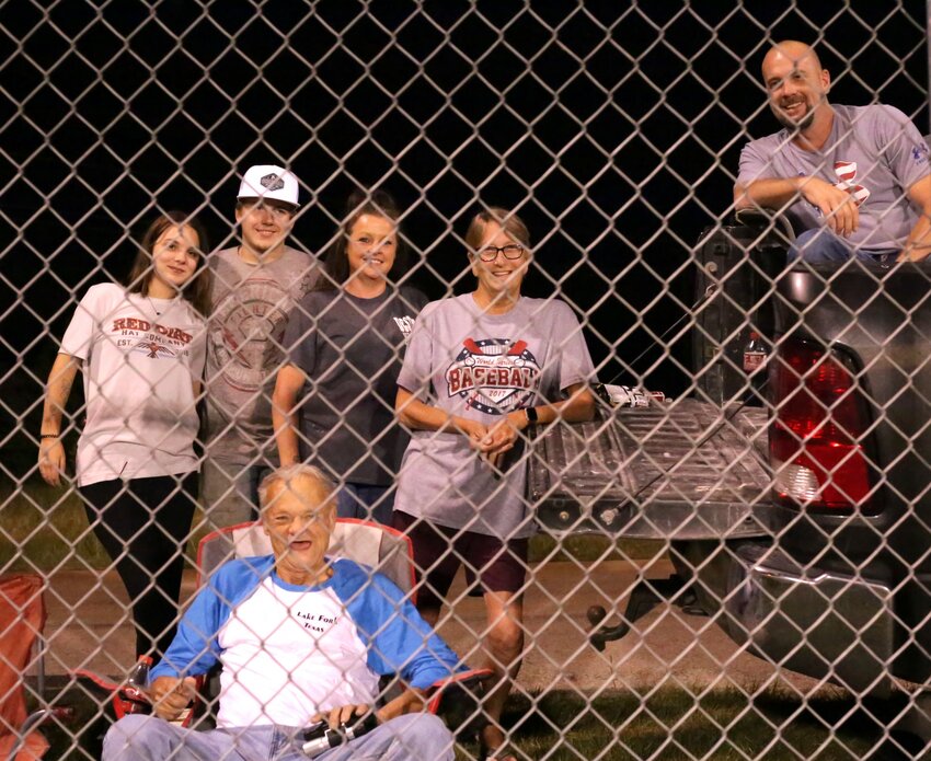 From left Alyssia Nipp, Jason Nipp, Trisha McCarthy, Kelly McCarthy, Kevin McCarthy, and Terry McCarthy (seated in foreground)&nbsp;enjoy the viewing from CR 2377.