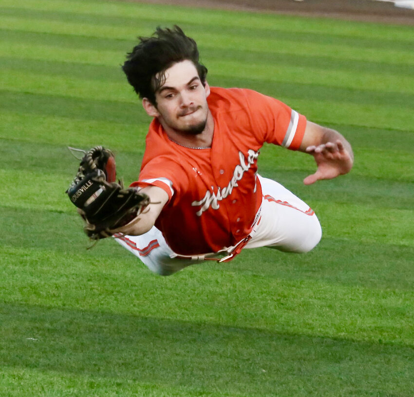 Yellowjacket Matthew Ballew makes a diving catch of a popped-up bunt.
