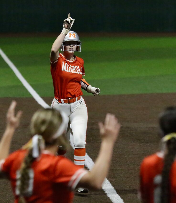 Lady Jacket Journie Wilson comes home after launching her second home run of the game against Eustace.