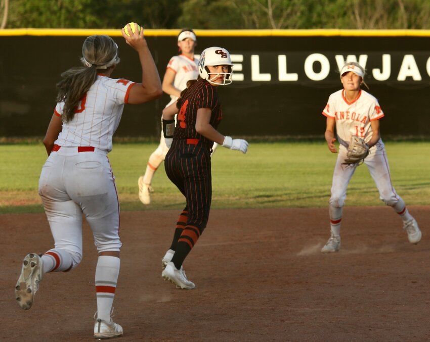 Mineola&rsquo;s&nbsp;Kali Chrietzberg (left with ball) and Kaitlyn McMahon have a Grand Saline base runner&nbsp;in a pickle between&nbsp;second and third. The runner beat the&nbsp;throw back&nbsp;to second and was safe.