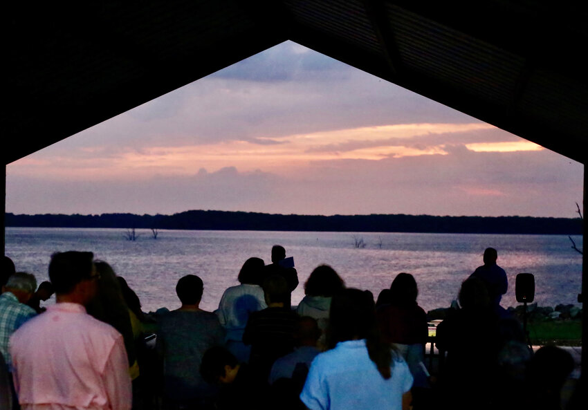 A break in the cloud layer at the Easter sunrise service by the First Baptist Church of Yantis at Lake Fork&rsquo;s Swearingen Park.