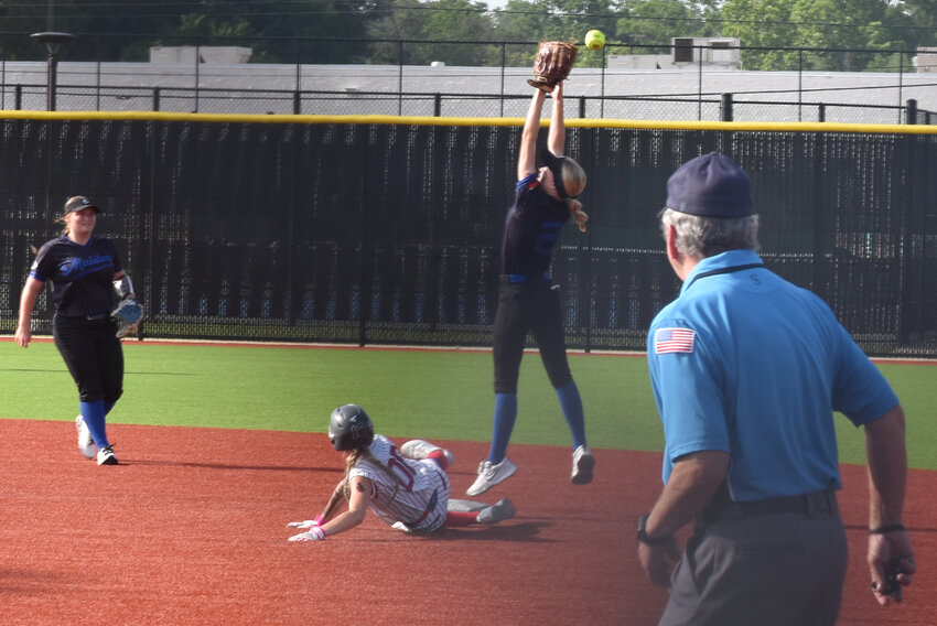 Alba-Golden’s Averi Stevenson slides in safely under the high throw to second. The Lady Panthers put up 21 runs in two games to sweep the area softball series over Frankston.